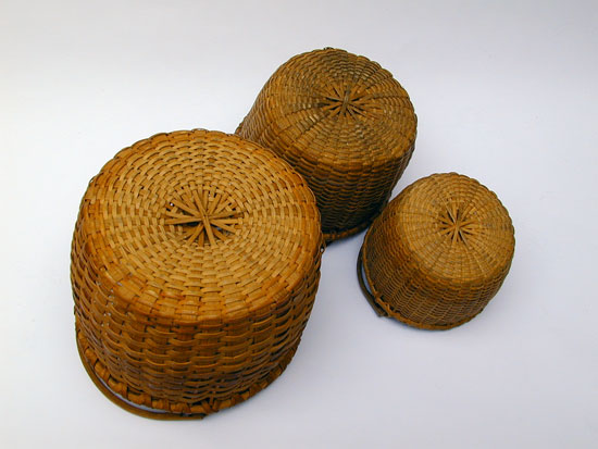 An Assembled Stacking Set of 3 Bale Handled Baskets 