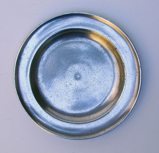 An Unmarked American Pewter Butter Plate