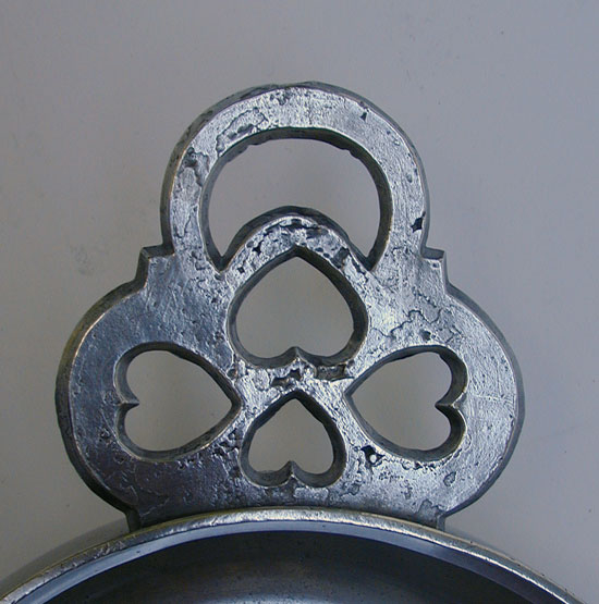 An Unmarked Large Heart Handle Porringer