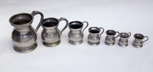 An Assembled Set of Enlish Pewter Bellied Pub Measures