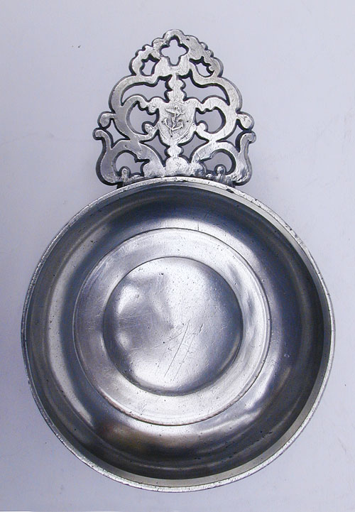 A Scarce Rhode Island Flower Handled Pewter Porringer by David Melville