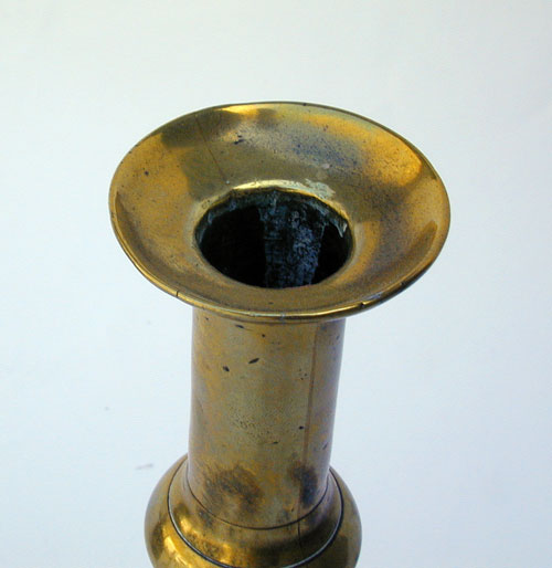 A Mid 18th Century English Push Up Brass Candlestick