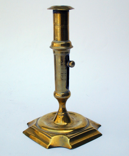 A Mid 18th Century English Push Up Brass Candlestick