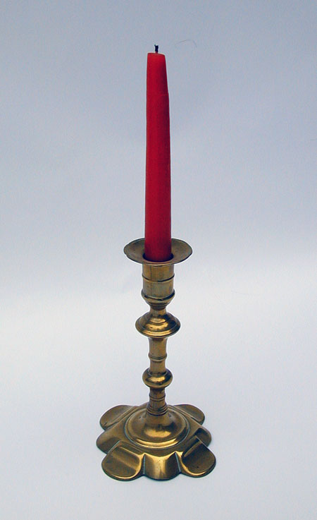 A Queen Anne Petal Base Brass Candlestick