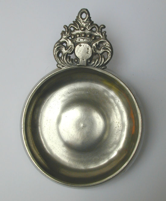 A Wide Bellied Crown Handle Porringer