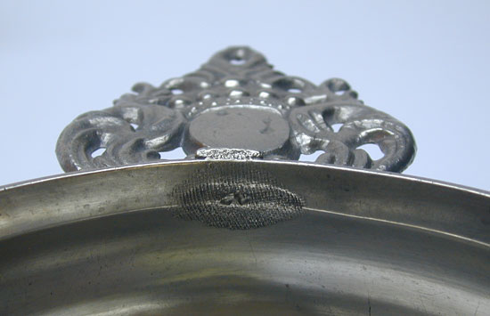 A Wide Bellied Crown Handle Porringer